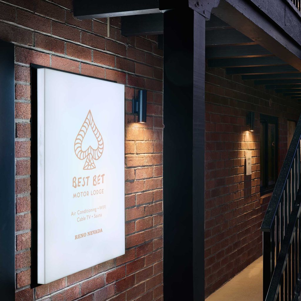 Best Bet Motor Lodge new brand identity, lobby glowing night-time sign